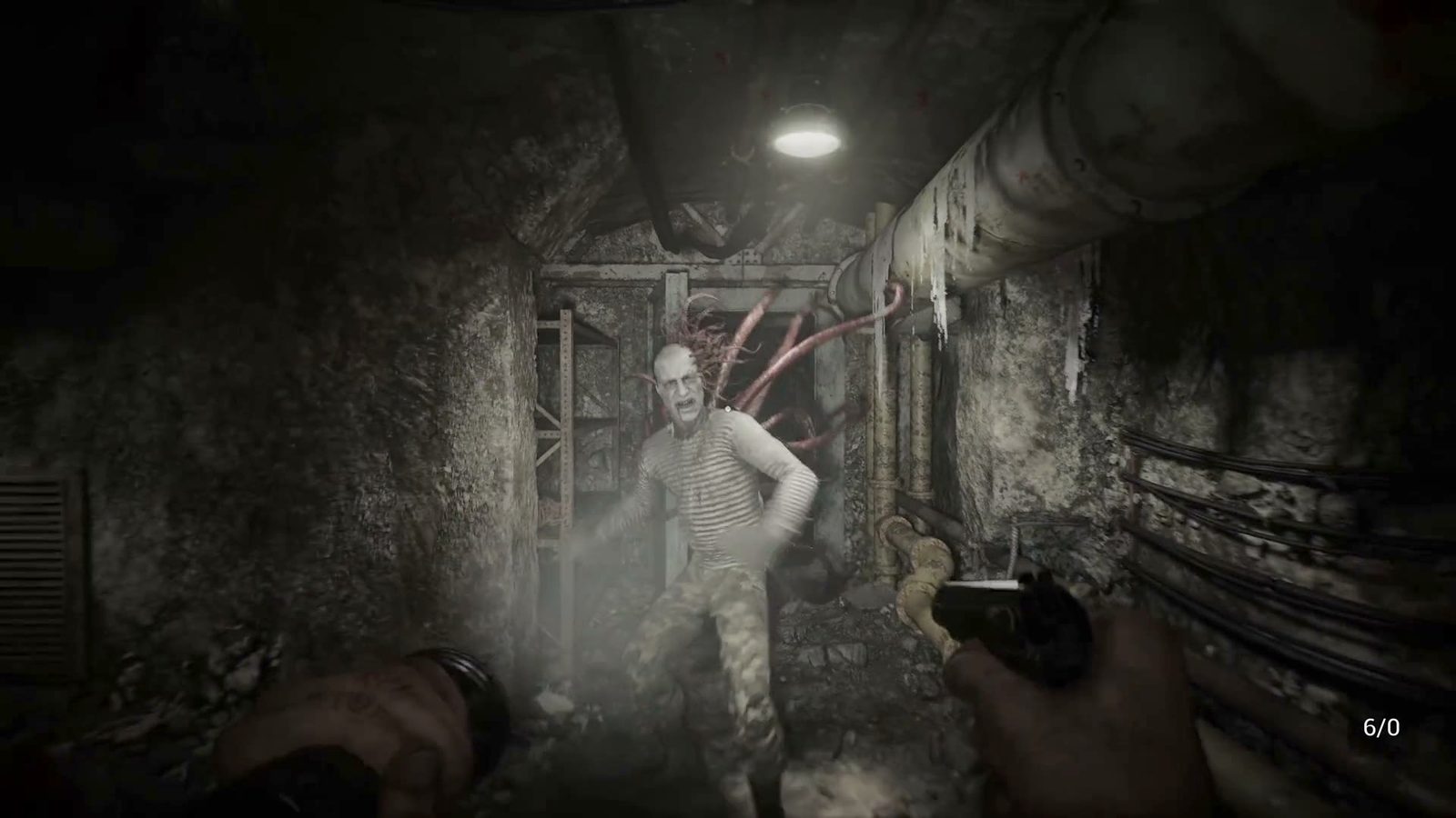 Official Steam trailer frame — a handgun and a handheld light in a dark interior
